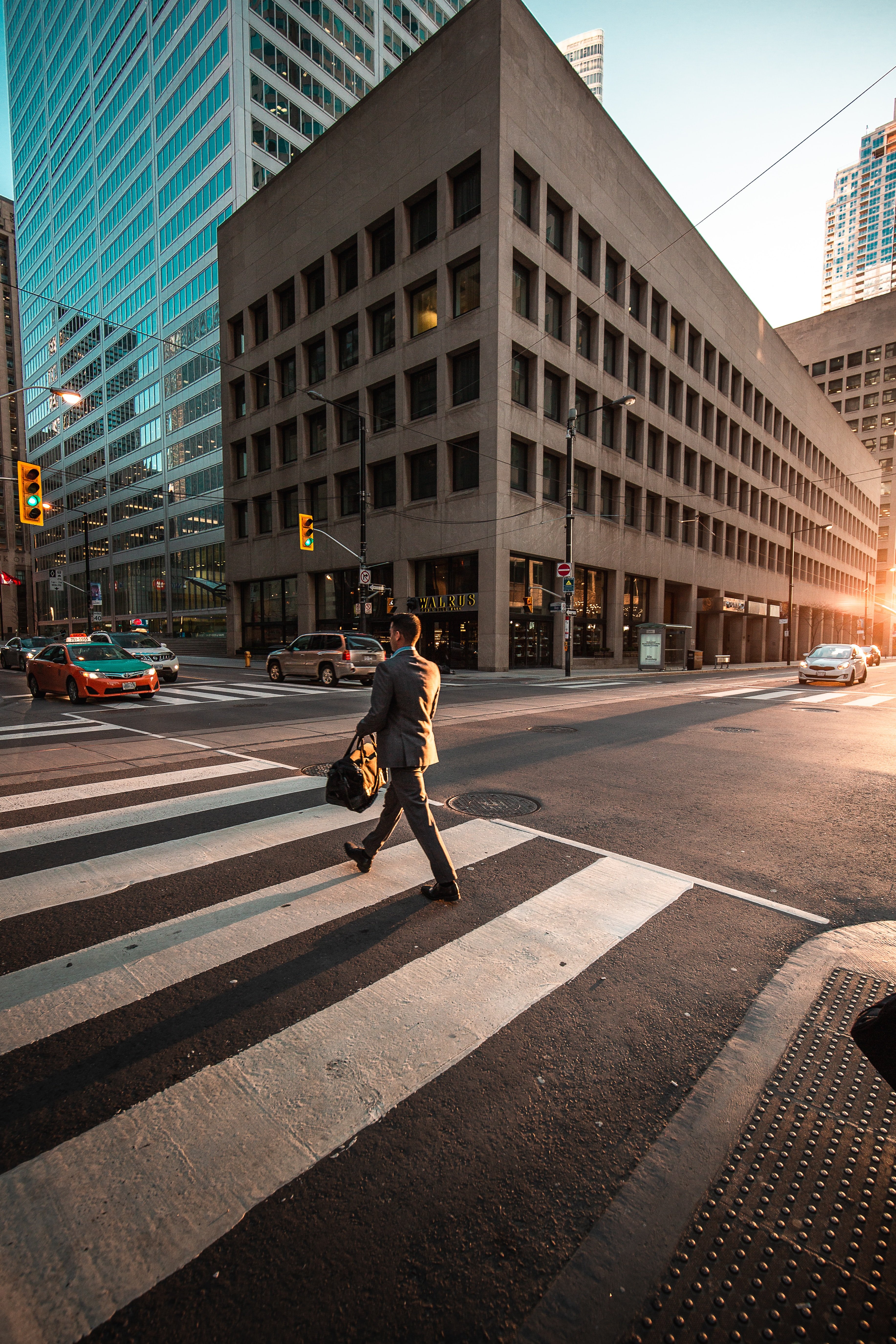 Walking across a zebra crossing with sunset advocacy